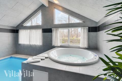 Genießen Sie den warmen Whirlpool im Luxusferienhaus Nr. 502 in Lolland/Falster/Mön