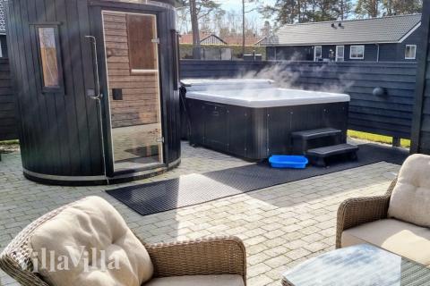 Genießen Sie den warmen Whirlpool im Luxusferienhaus Nr. 515 in Lolland/Falster/Mön