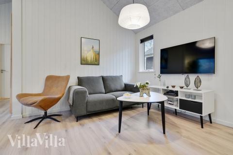 Die Couch im Luxusferienhaus Nr. 517 in Lolland/Falster/Mön lädt zu Gesellschaftsspielen oder zu Kinoabenden ein.