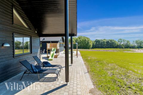 Genießen Sie einen Grillabend auf der Terrasse des Luxusferienhauses Nr. 493 in Südjütland