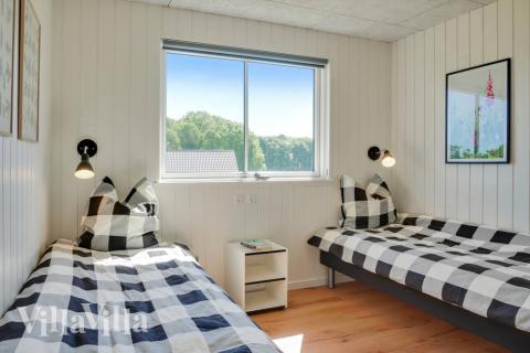 Eines der 9 Schlafzimmer im Luxusferienhaus Nr. 493