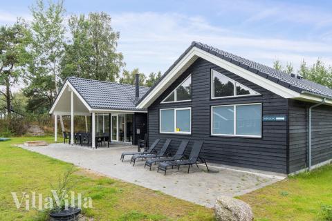 Genießen Sie einen Grillabend auf der Terrasse des Luxusferienhauses Nr. 506 in Lolland/Falster/Mön