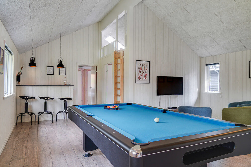 Neben den vielen schönen Stunden, die man im Poolbereich des Hauses verbringen kann, bietet das Luxusferienhaus 506 auch Spielevergnügen bei Billard/Tischtennis und Darts