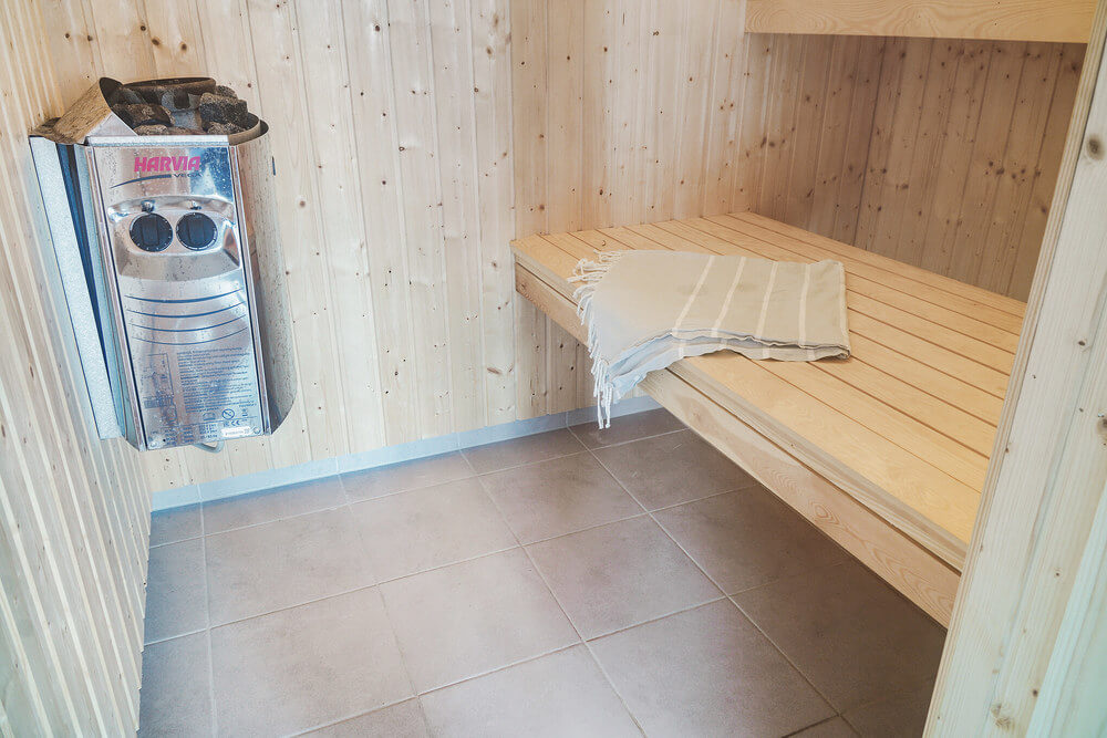 Genießen Sie die heiße Sauna im Luxusferienhaus Nr. 506 für 18 Personen