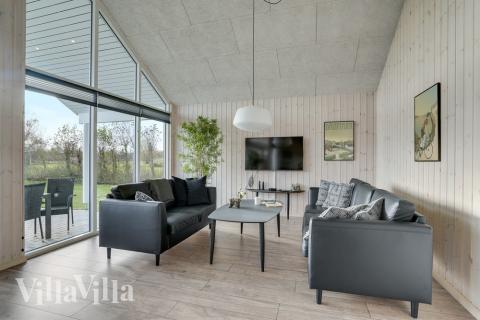 Die Couch im Luxusferienhaus Nr. 522 in Lolland/Falster/Mön lädt zu Gesellschaftsspielen oder zu Kinoabenden ein.