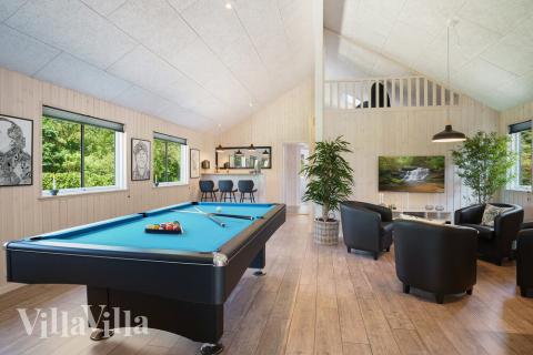 Neben den vielen schönen Stunden, die man im Poolbereich des Hauses verbringen kann, bietet das Luxusferienhaus 498 auch Spielevergnügen bei Billard/Tischtennis und Darts