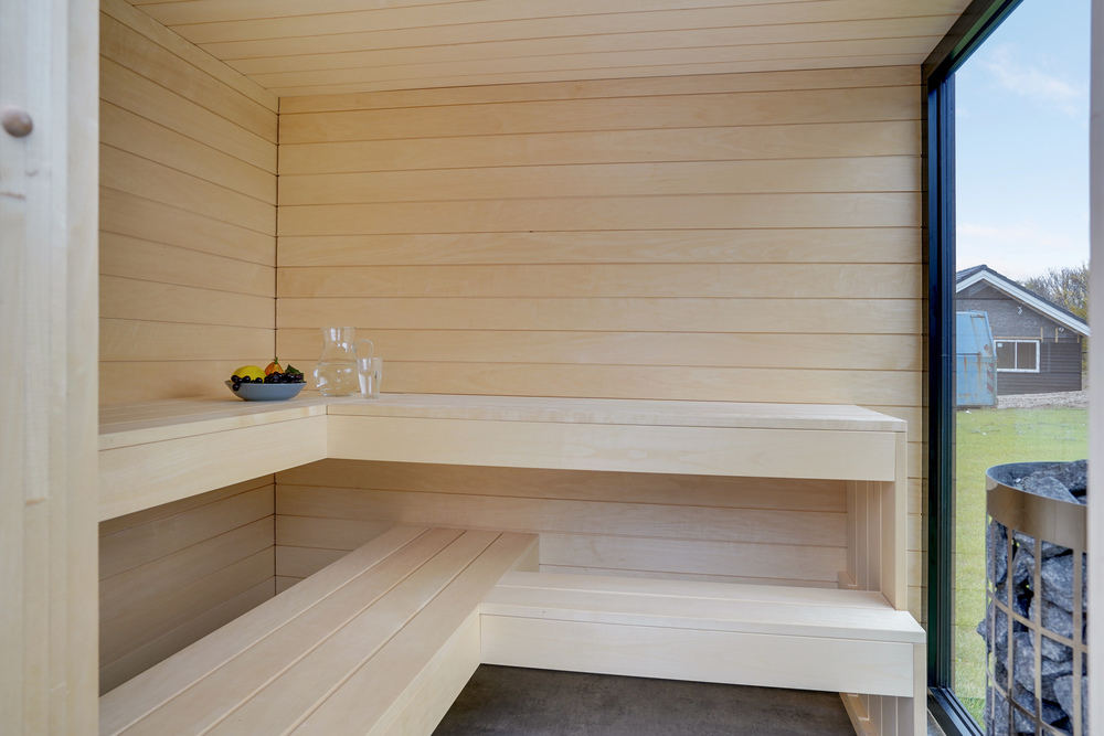 Genießen Sie die heiße Sauna im Luxusferienhaus Nr. 521 für 16 Personen