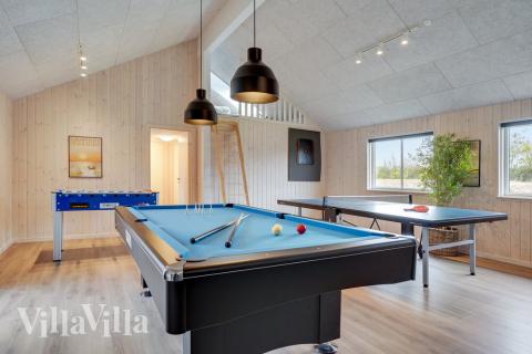 Neben den vielen schönen Stunden, die man im Poolbereich des Hauses verbringen kann, bietet das Luxusferienhaus 508 auch Spielevergnügen bei Billard/Tischtennis und Darts