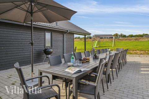 Genießen Sie einen Grillabend auf der Terrasse des Luxusferienhauses Nr. 499 in Südjütland