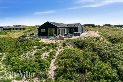 Genießen Sie den warmen Whirlpool im Luxusferienhaus Nr. 514 in Nordjütland