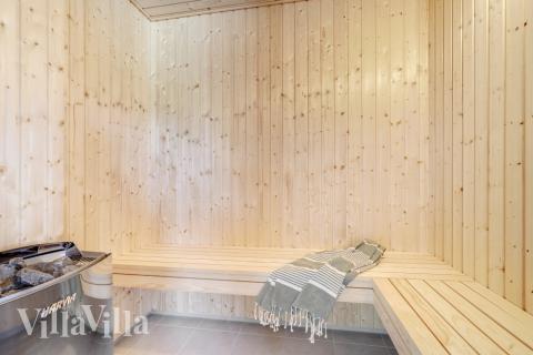 Genießen Sie die heiße Sauna im Luxusferienhaus Nr. 516 für 24 Personen