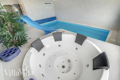 Genießen Sie den warmen Whirlpool im Luxusferienhaus Nr. 516 in Westjütland