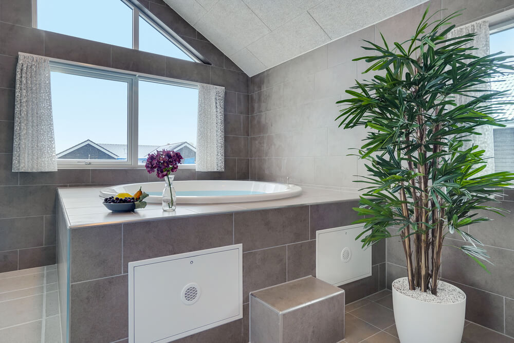 Genießen Sie den warmen Whirlpool im Luxusferienhaus Nr. 526 in Südjütland
