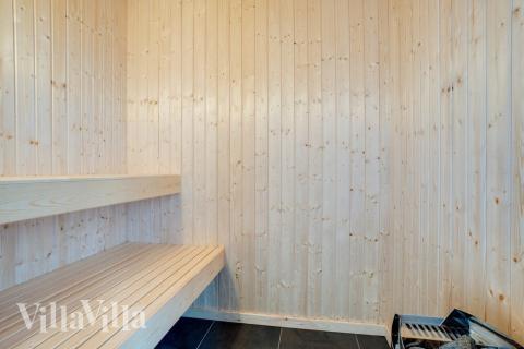 Genießen Sie die heiße Sauna im Luxusferienhaus Nr. 518 für 14 Personen