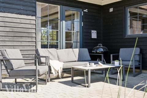Genießen Sie einen Grillabend auf der Terrasse des Luxusferienhauses Nr. 518 in Westjütland