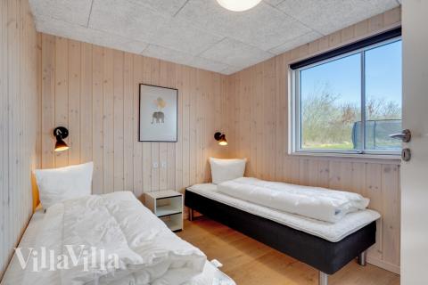 Eines der 7 Schlafzimmer im Luxusferienhaus Nr. 488