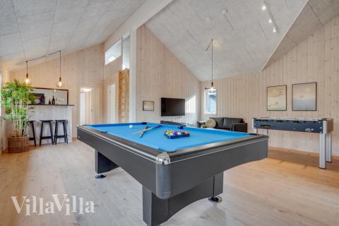Neben den vielen schönen Stunden, die man im Poolbereich des Hauses verbringen kann, bietet das Luxusferienhaus 488 auch Spielevergnügen bei Billard/Tischtennis und Darts