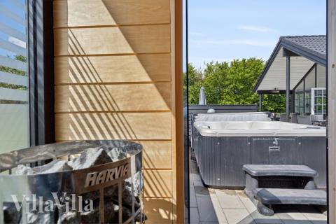 Genießen Sie die heiße Sauna im Luxusferienhaus Nr. 520 für 18 Personen