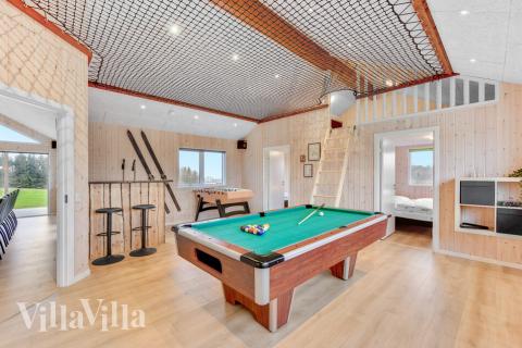 Neben den vielen schönen Stunden, die man im Poolbereich des Hauses verbringen kann, bietet das Luxusferienhaus 539 auch Spielevergnügen bei Billard/Tischtennis und Darts