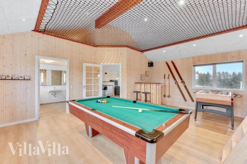 Aktivitätsraum im Luxusferienhaus Nr. 539 mit 4 Schlafzimmern und Platz für 14 Gäste.