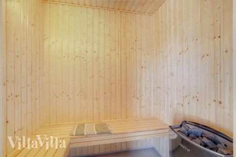 Genießen Sie die heiße Sauna im Luxusferienhaus Nr. 542 für 26 Personen