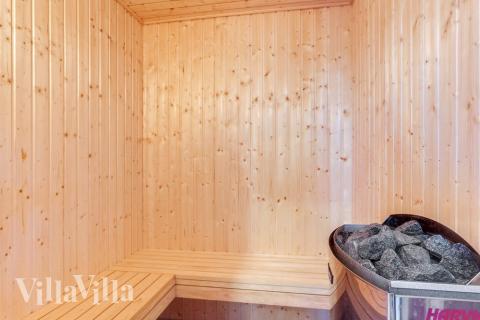 Genießen Sie die heiße Sauna im Luxusferienhaus Nr. 543 für 16 Personen