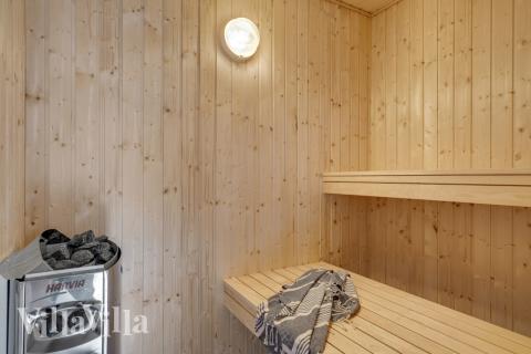 Genießen Sie die heiße Sauna im Luxusferienhaus Nr. 568 für 16 Personen