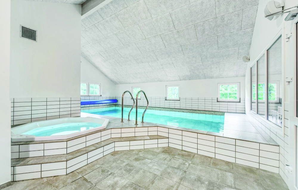 Genießen Sie den warmen Whirlpool im Luxusferienhaus Nr. 570 in Westjütland