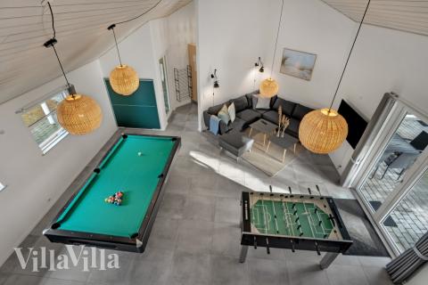 Das Luxusferienhaus 571 für 22 Personen hat einen großen Aktivitätsraum mit u. a. Billard und Darts