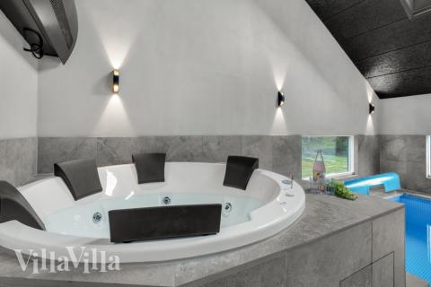 Genießen Sie den warmen Whirlpool im Luxusferienhaus Nr. 571 in Südjütland