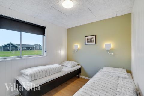 Eines der 9 Schlafzimmer im Luxusferienhaus Nr. 551