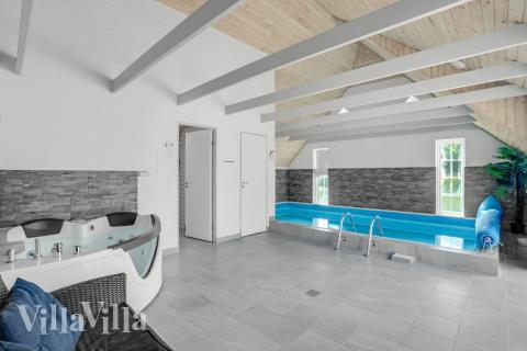 Genießen Sie den warmen Whirlpool im Luxusferienhaus Nr. 572 in Westjütland