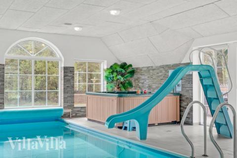 Genießen Sie den warmen Whirlpool im Luxusferienhaus Nr. 573 in Westjütland