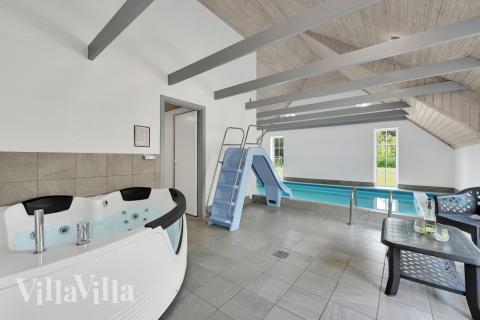 Genießen Sie den warmen Whirlpool im Luxusferienhaus Nr. 574 in Westjütland