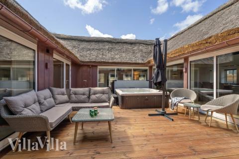 Genießen Sie einen Grillabend auf der Terrasse des Luxusferienhauses Nr. 580 in Westjütland