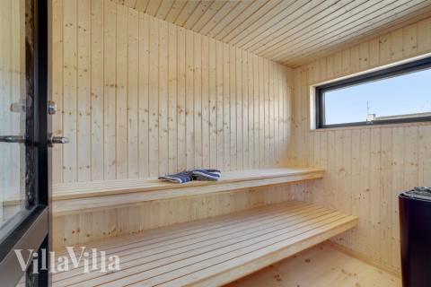 Genießen Sie die heiße Sauna im Luxusferienhaus Nr. 580 für 16 Personen