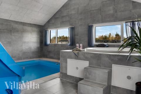 Genießen Sie den warmen Whirlpool im Luxusferienhaus Nr. 554 in Westjütland
