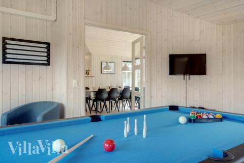 Neben den vielen schönen Stunden, die man im Poolbereich des Hauses verbringen kann, bietet das Luxusferienhaus 578 auch Spielevergnügen bei Billard/Tischtennis und Darts