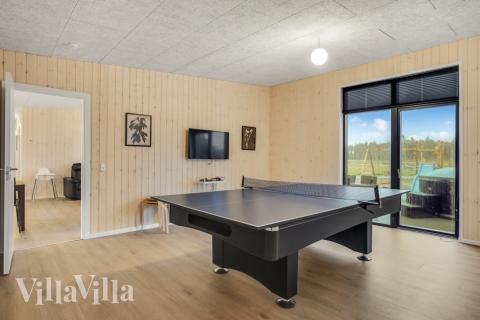 Neben den vielen schönen Stunden, die man im Poolbereich des Hauses verbringen kann, bietet das Luxusferienhaus 581 auch Spielevergnügen bei Billard/Tischtennis und Darts