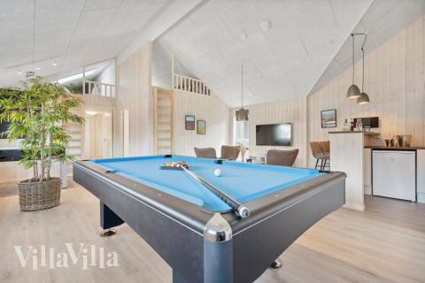 Neben den vielen schönen Stunden, die man im Poolbereich des Hauses verbringen kann, bietet das Luxusferienhaus 601 auch Spielevergnügen bei Billard/Tischtennis und Darts
