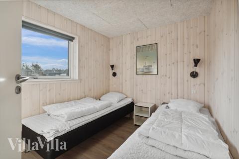 Eines der 8 Schlafzimmer im Luxusferienhaus Nr. 591