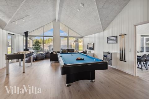 Neben den vielen schönen Stunden, die man im Poolbereich des Hauses verbringen kann, bietet das Luxusferienhaus 591 auch Spielevergnügen bei Billard/Tischtennis und Darts