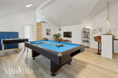 Neben den vielen schönen Stunden, die man im Poolbereich des Hauses verbringen kann, bietet das Luxusferienhaus 593 auch Spielevergnügen bei Billard/Tischtennis und Darts