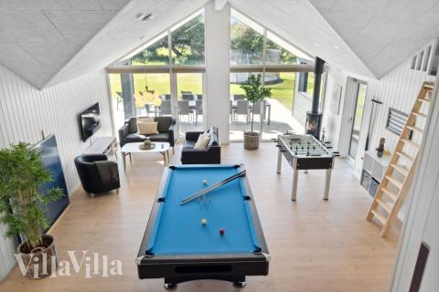 Neben den vielen schönen Stunden, die man im Poolbereich des Hauses verbringen kann, bietet das Luxusferienhaus 596 auch Spielevergnügen bei Billard/Tischtennis und Darts