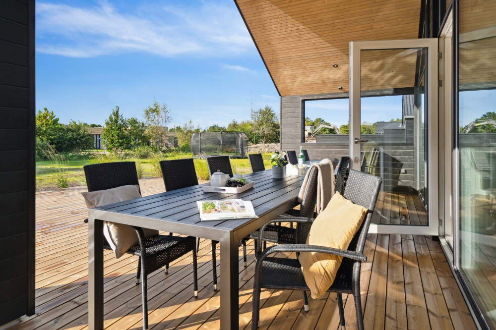 Genießen Sie einen Grillabend auf der Terrasse des Luxusferienhauses Nr. 599 in Südjütland