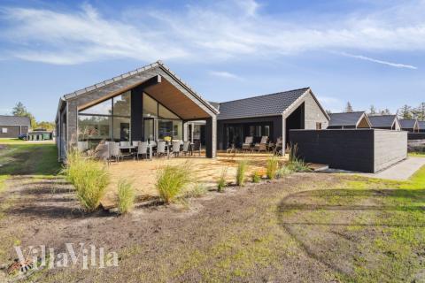 Das Luxusferienhaus Nr. 599 hat eine tolle Terrasse, die mit hochwertigen Gartenmöbeln für 16 Personen ausgestattet ist.