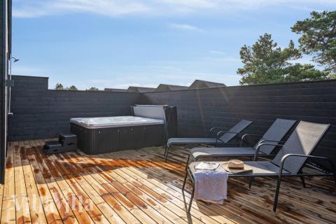 Genießen Sie den warmen Whirlpool im Luxusferienhaus Nr. 599 in Südjütland