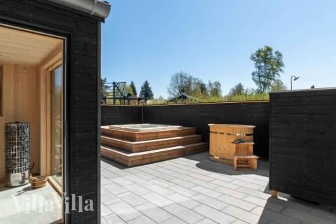 Genießen Sie den warmen Whirlpool im Luxusferienhaus Nr. 582 in Nordseeland