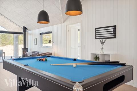 Neben den vielen schönen Stunden, die man im Poolbereich des Hauses verbringen kann, bietet das Luxusferienhaus 585 auch Spielevergnügen bei Billard/Tischtennis und Darts