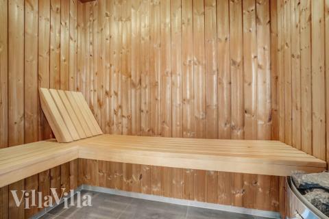 Genießen Sie die heiße Sauna im Luxusferienhaus Nr. 548 für 20 Personen